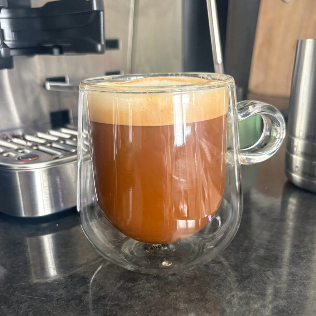 Americano Made Using the Ninja Luxe Café Premier With Frothy Oat Milk
