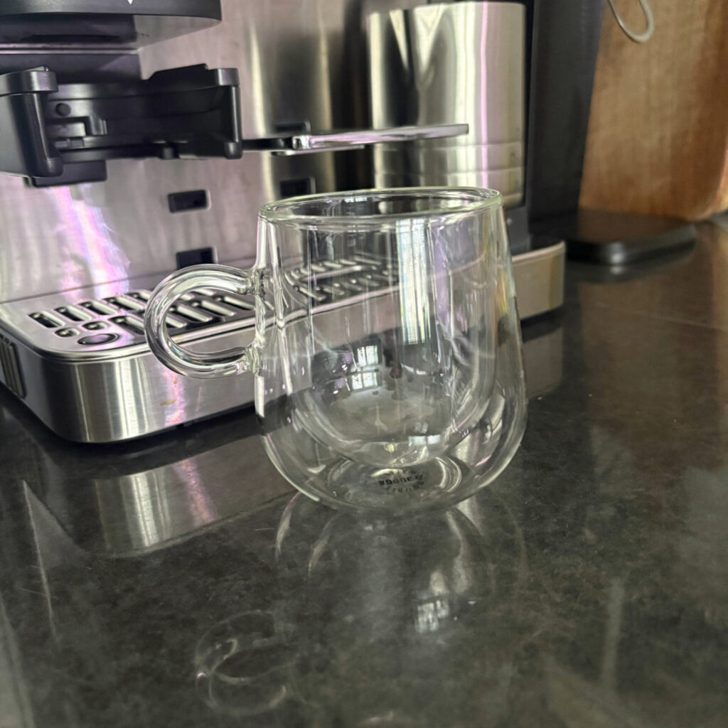 a double walled insulated glass mug to keep coffee warmer for longer