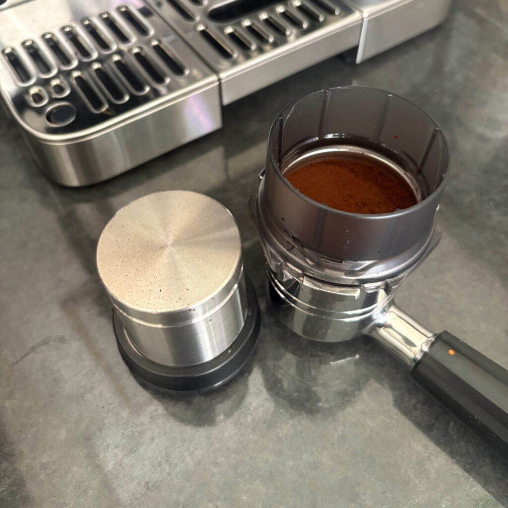 Tamper and Portafilter/Funnel with Tamped Ground Coffee